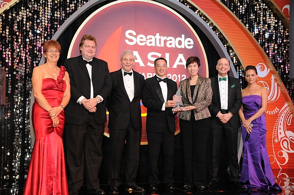 Photo showing the award being presented to Kenneth Koo by Mrs. Josephine Teo, Minister of State, Ministry of Finance and Ministry of Transport, Singapore.